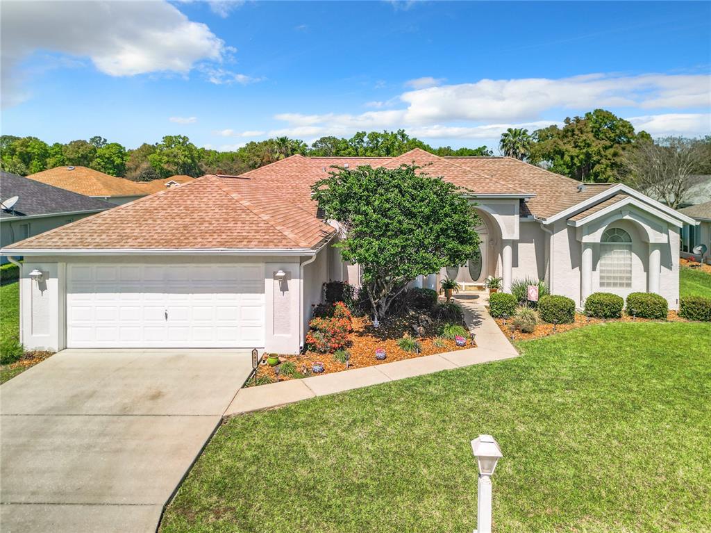 5495 Northwest 25th Loop Ocala, FL 34482 - Photo 1 of 1 front view of house with a yard