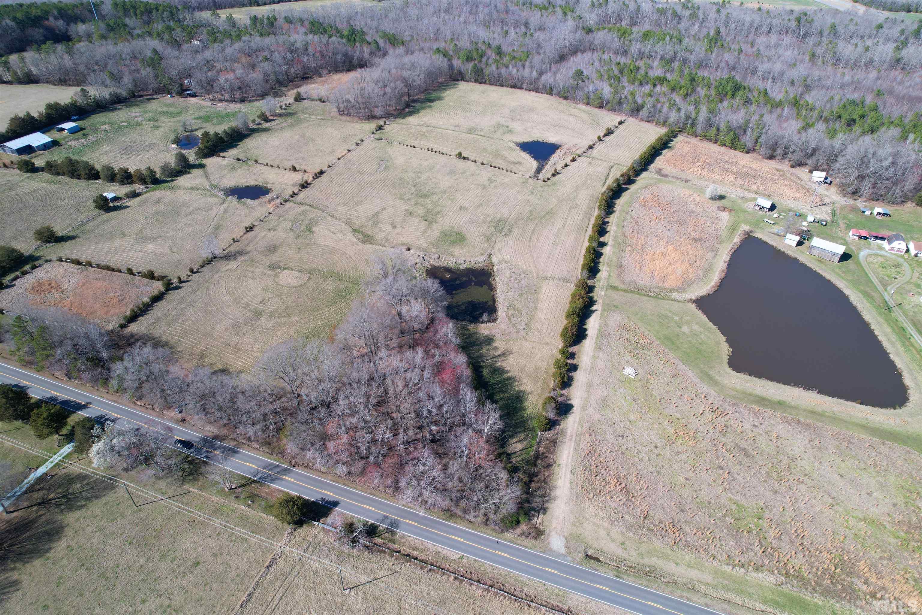 506 Bacon Road Rougemont, NC 27572 - Photo 2 of 9 a view of a backyard