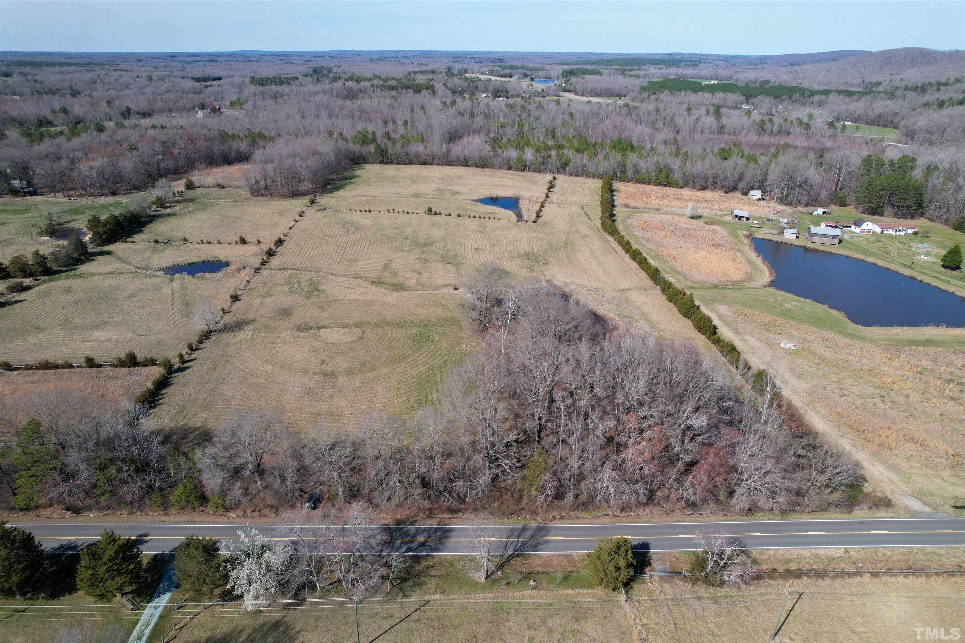506 Bacon Road Rougemont, NC 27572 - Photo 3 of 9 a view of a dry yard with wooden fence
