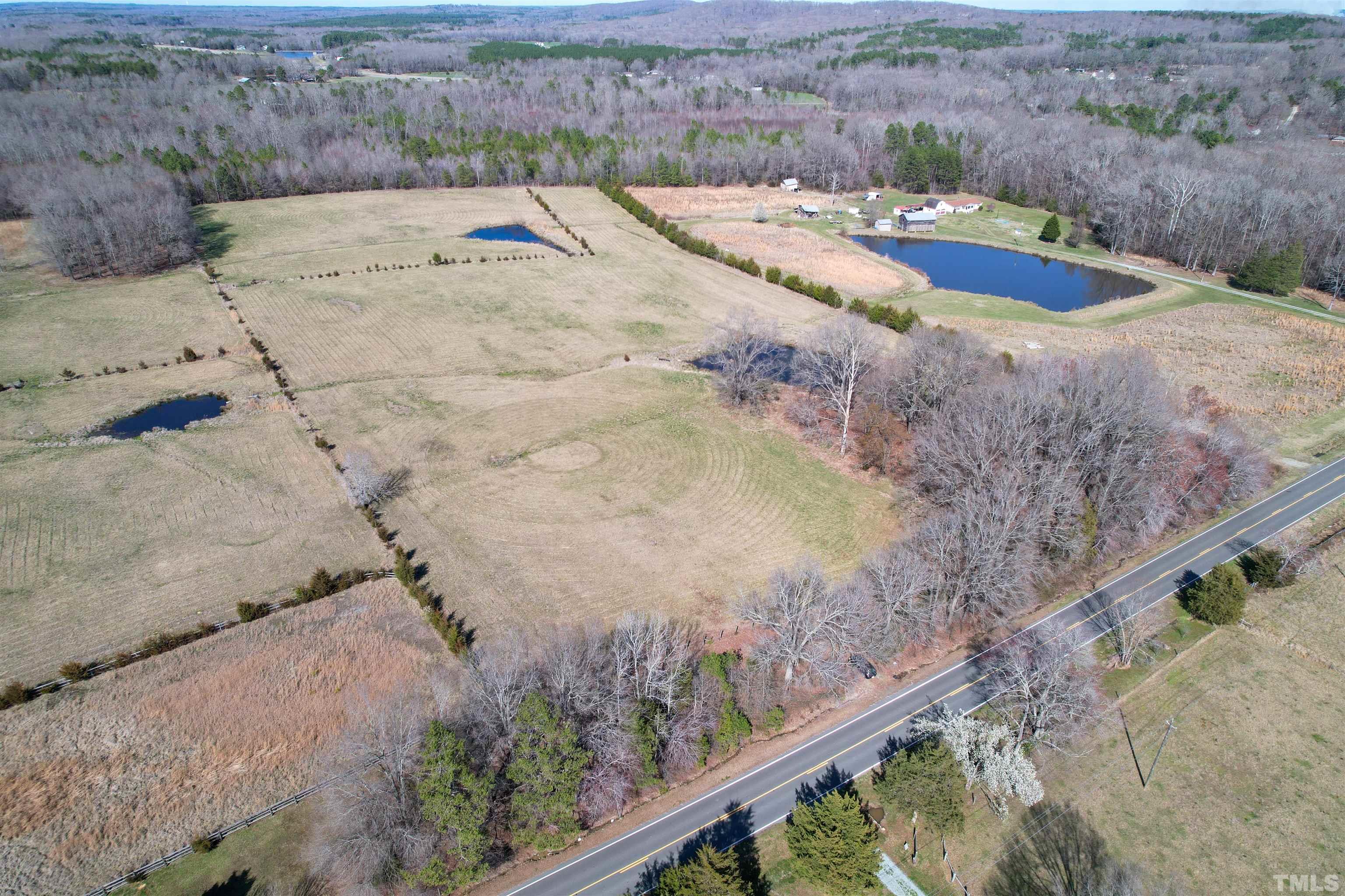 506 Bacon Road Rougemont, NC 27572 - Photo 4 of 9 a view of a backyard with wooden fence