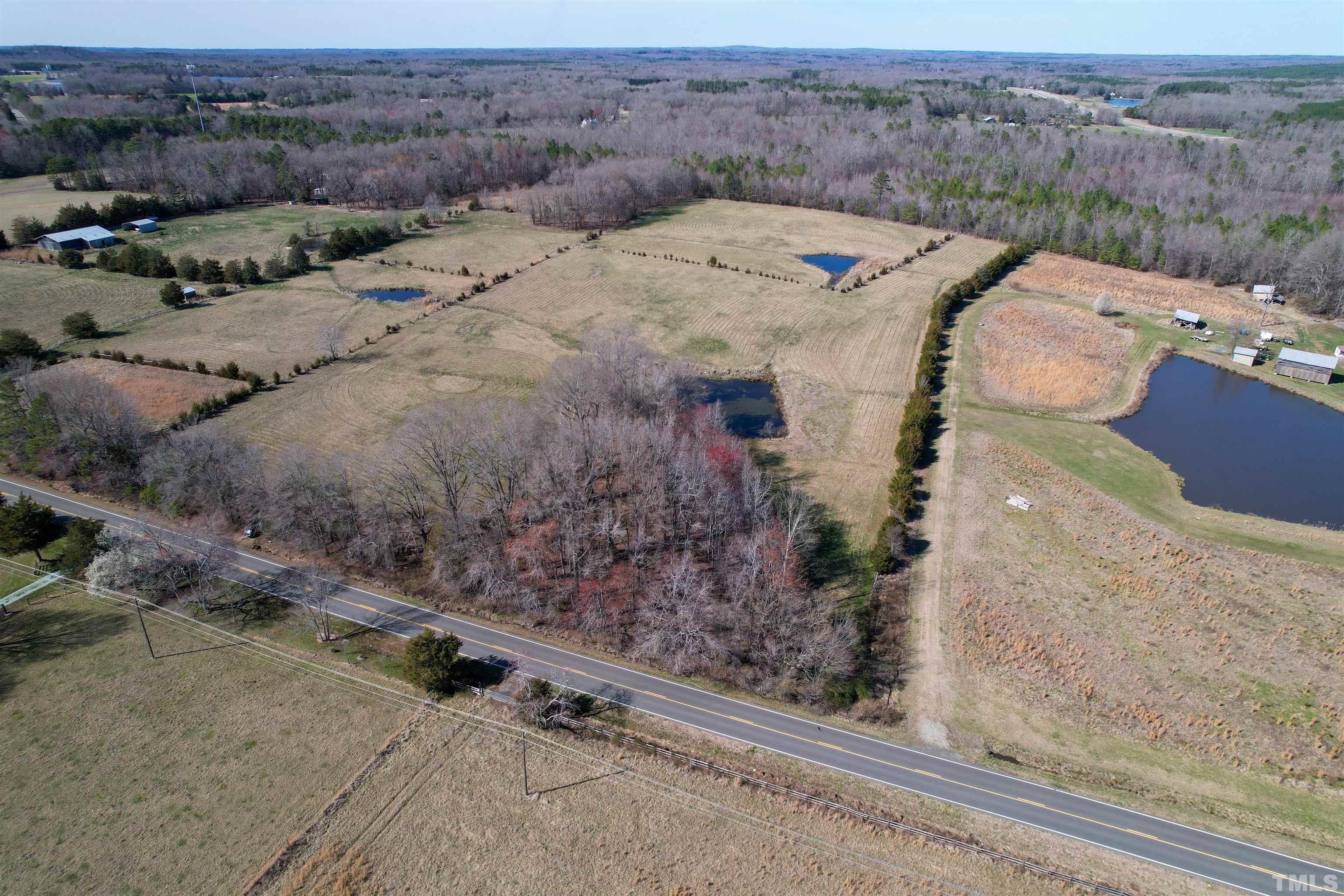 506 Bacon Road Rougemont, NC 27572 - Photo 9 of 9 an aerial view of a house with a yard and garage