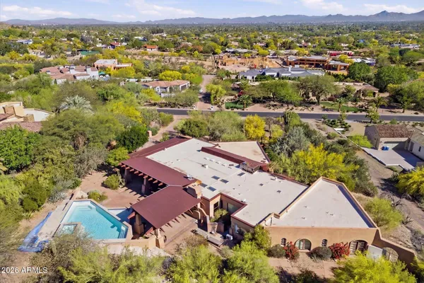 an aerial view of residential houses with outdoor space