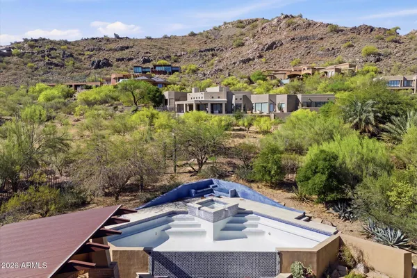 a view of a balcony with a table and chairs