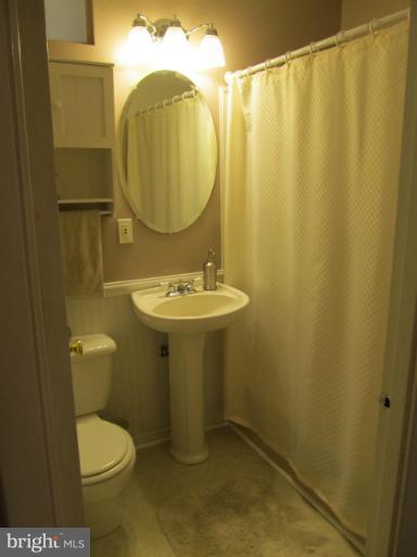 2504 Pleasantville Road Fallston, MD 21047 - Photo 17 of 30 a bathroom with a sink mirror and toilet