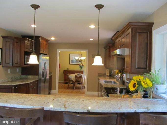 2504 Pleasantville Road Fallston, MD 21047 - Photo 21 of 30 a kitchen with sink refrigerator dining table and chairs