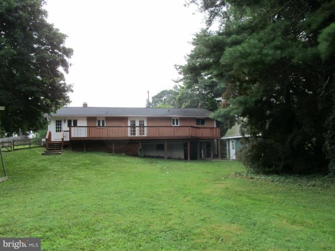 2504 Pleasantville Road Fallston, MD 21047 - Photo 29 of 30 a view of a house next to a big yard and large trees