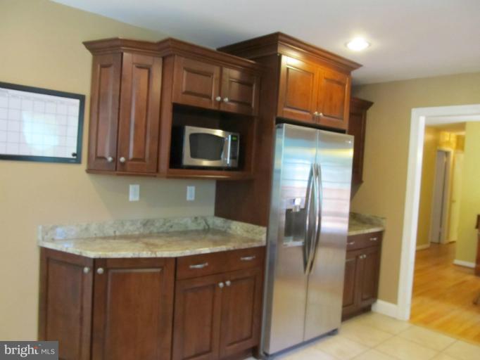 2504 Pleasantville Road Fallston, MD 21047 - Photo 7 of 30 a kitchen with stainless steel appliances granite countertop a refrigerator and a sink