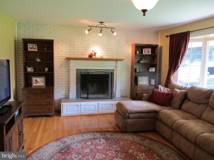 2504 Pleasantville Road Fallston, MD 21047 - Photo 10 of 30 a living room with furniture and a fireplace