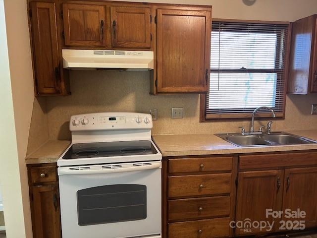 2601 Bob White Circle Wingate, NC 28174 - Photo 10 of 25 a kitchen with appliances cabinets and a sink