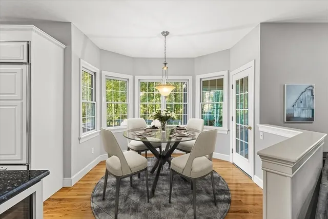 a view of a dining room with furniture window and outside view