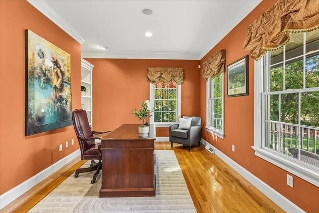a dining room with furniture a rug and wooden floor