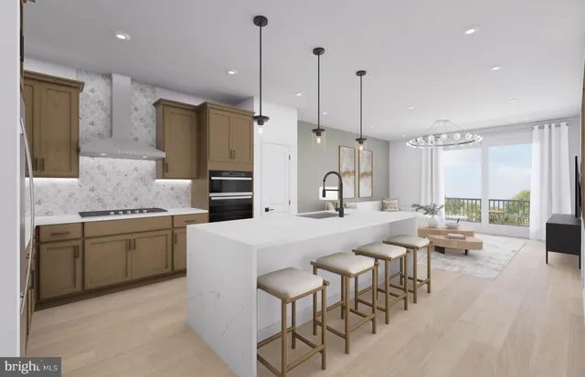 a large kitchen with kitchen island a large island in it