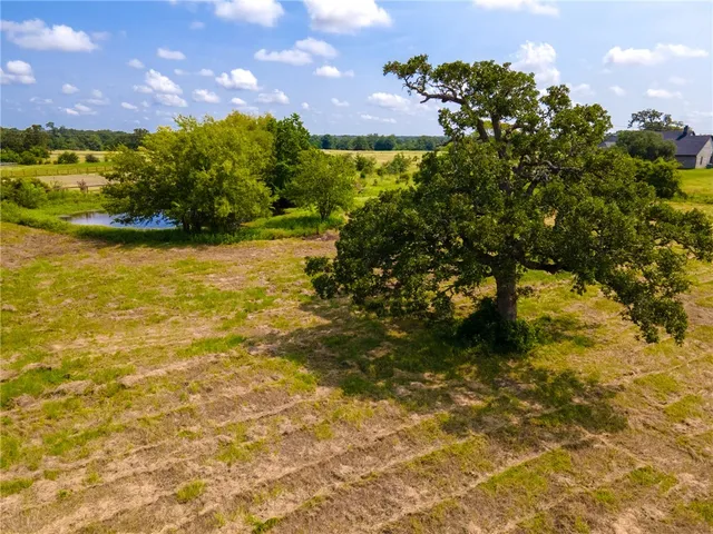 a view of a lake with a yard