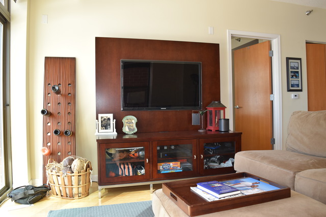 1250 South Indiana Avenue, Unit 606 Chicago, IL 60605 - Photo 9 of 16 a living room with furniture and wooden floor