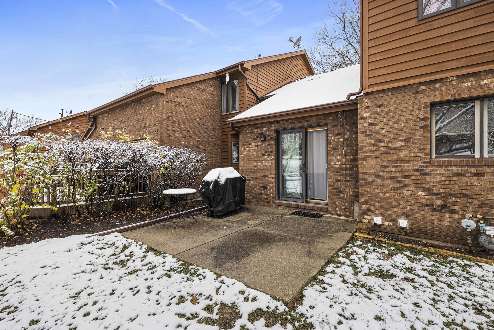 6211 Maple Street, Unit 103 Marengo, IL 60152 - Photo 19 of 20 a view of a house with a patio