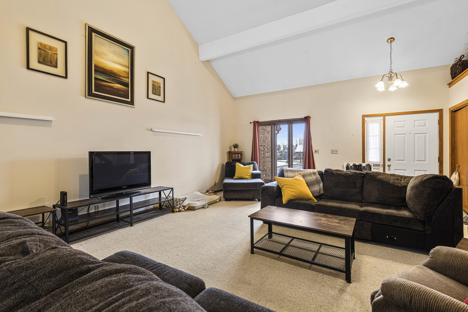 6211 Maple Street, Unit 103 Marengo, IL 60152 - Photo 2 of 20 a living room with furniture and a flat screen tv