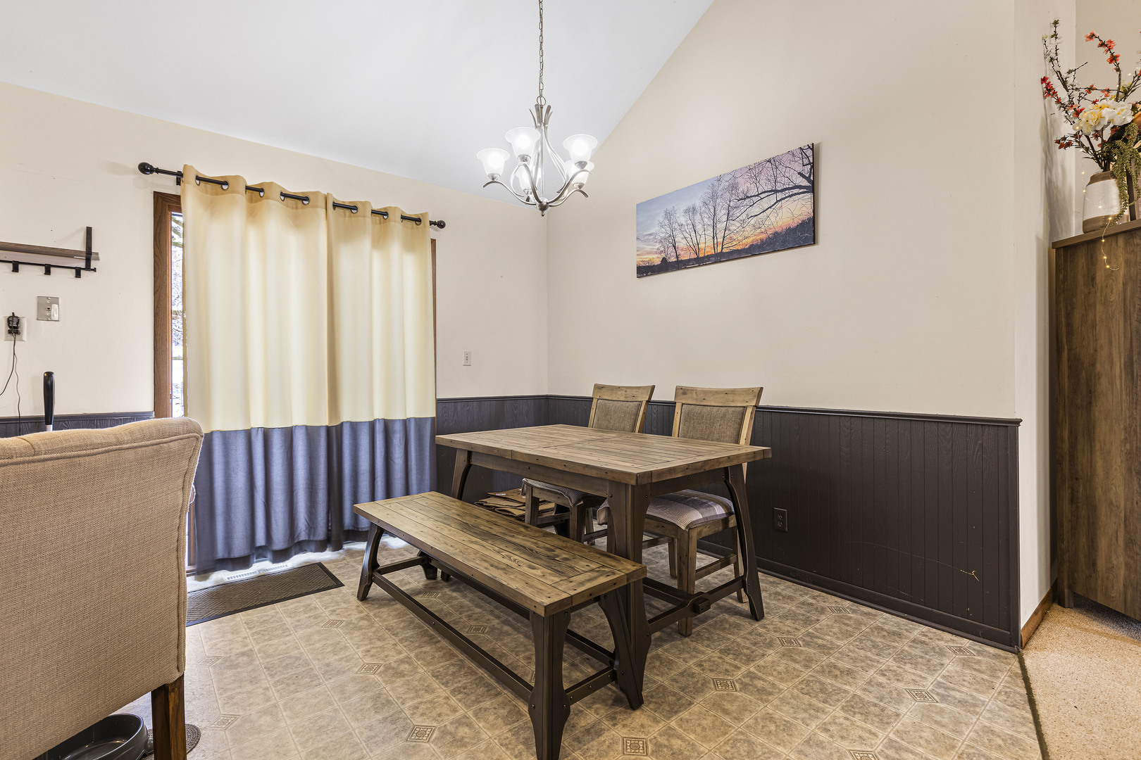 6211 Maple Street, Unit 103 Marengo, IL 60152 - Photo 5 of 20 a view of a workspace with furniture and a chandelier