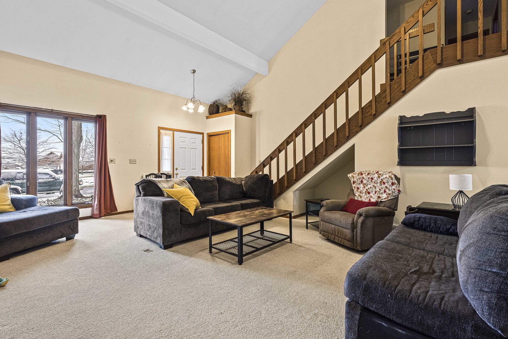 6211 Maple Street, Unit 103 Marengo, IL 60152 - Photo 6 of 20 a living room with furniture and a ceiling fan