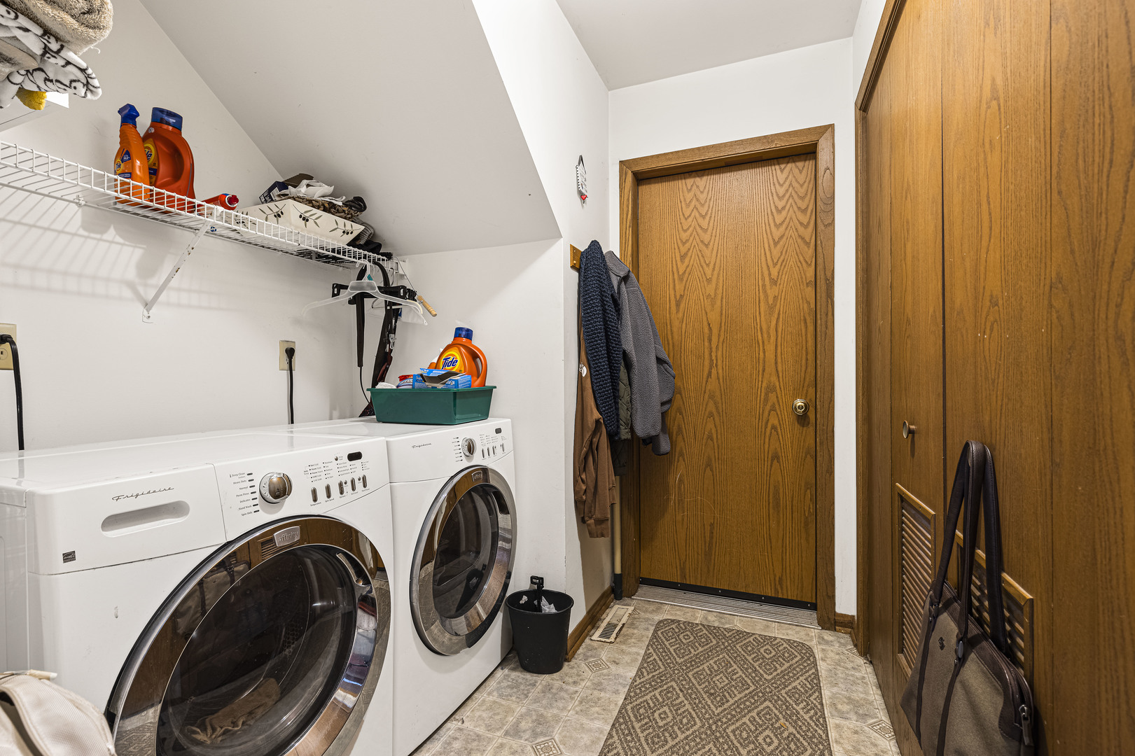 6211 Maple Street, Unit 103 Marengo, IL 60152 - Photo 10 of 20 a view of storage and utility room with washer and dryer