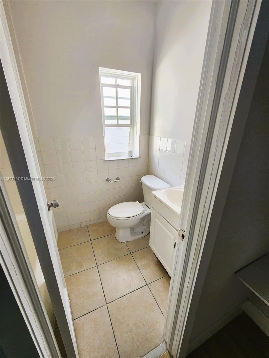 7611 Harding Avenue, Unit 8 Miami Beach, FL 33141 - Photo 11 of 19 a bathroom with a sink and a toilet