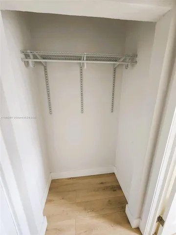 a view of a room with racks on the wall