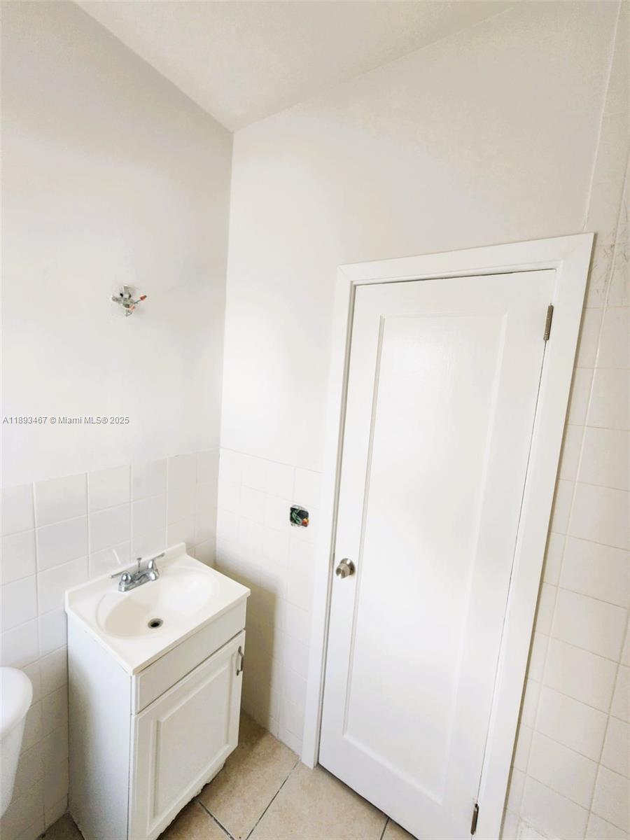 7611 Harding Avenue, Unit 8 Miami Beach, FL 33141 - Photo 10 of 19 a white cabinet door