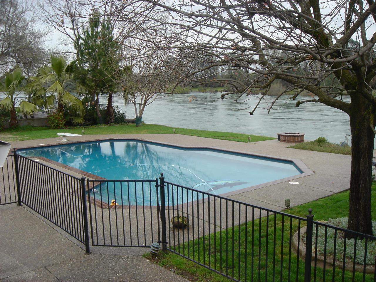 a view of a balcony with yard