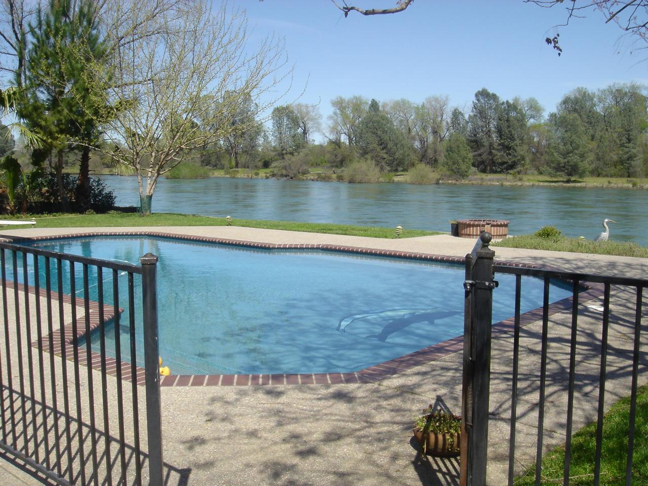 6341 Riverside Drive Redding, CA 96001 - Photo 4 of 20 a view of a lake with a mountain