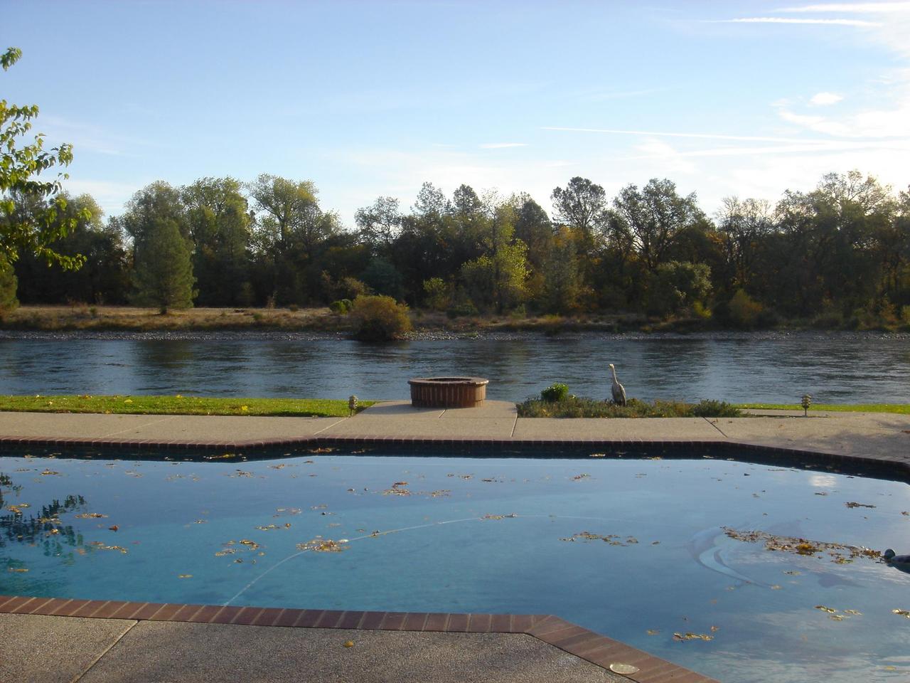 6341 Riverside Drive Redding, CA 96001 - Photo 6 of 20 a view of a swimming pool with an outdoor space