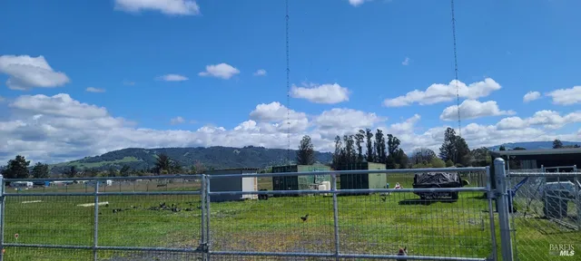 a view of a lake and a yard