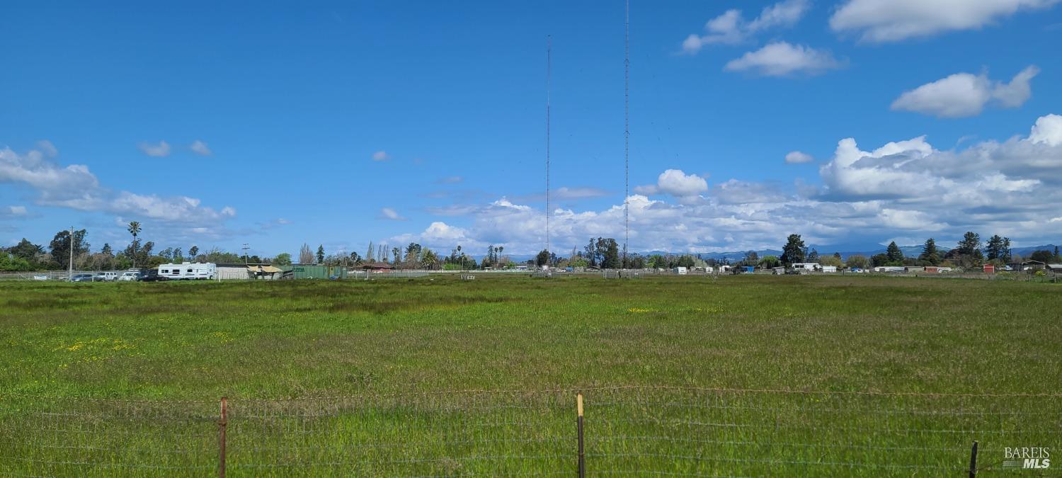 391 Millbrae Avenue Santa Rosa, CA 95407 - Photo 5 of 8 a view of a lake and a yard