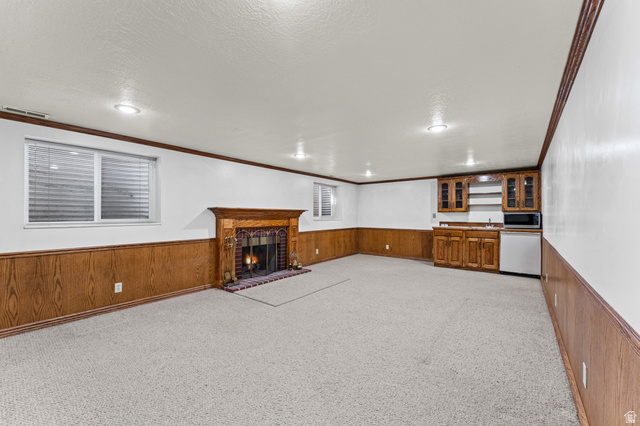 8441 Rua Branco Drive Sandy, UT 84093 - Photo 36 of 47 Spacious recreational room featuring wood-finish wainscoting, recessed ceiling lighting, and carpet flooring