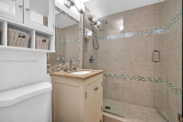 a bedroom with a bed and a wooden floor