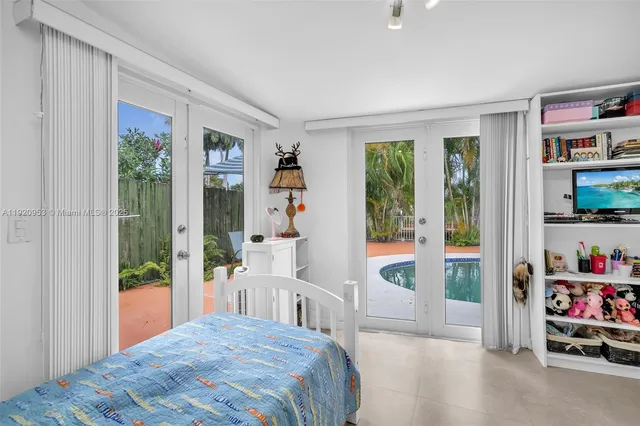 a view of a patio with a table and chairs