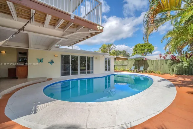 a view of a lake with boats and trees in the background