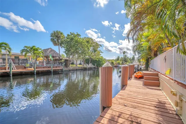a house with swimming pool in front of it