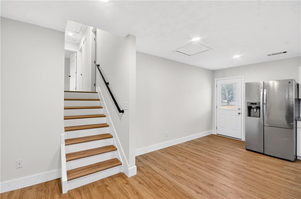 2776 Parcel Road Austell, GA 30106 - Photo 13 of 30 a view of a kitchen with wooden floor and stairs