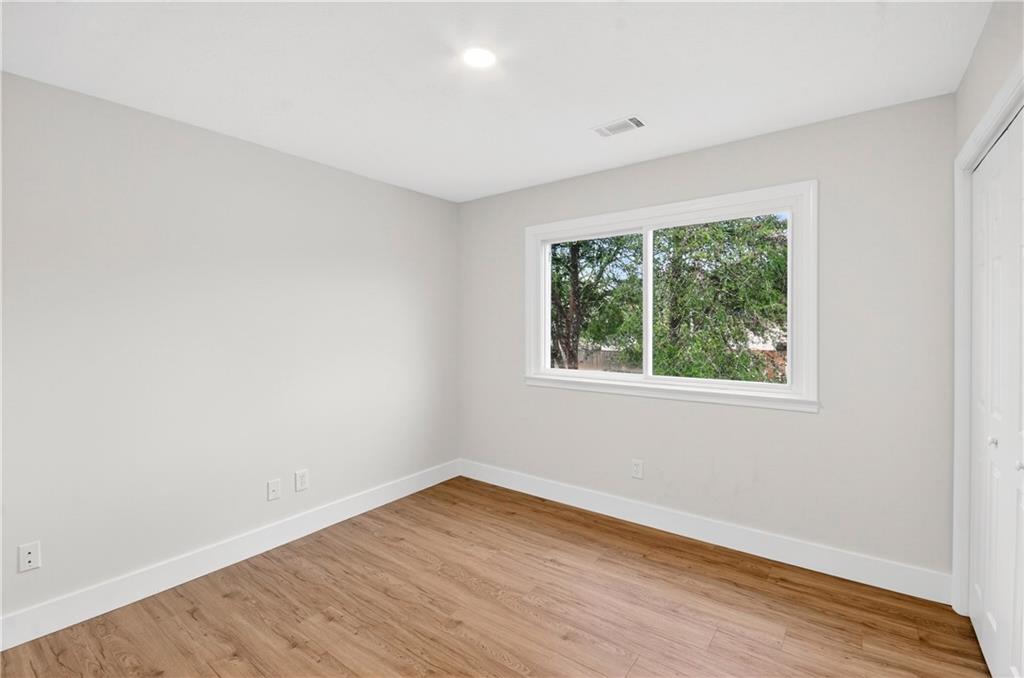 2776 Parcel Road Austell, GA 30106 - Photo 15 of 30 an empty room with wooden floor and windows