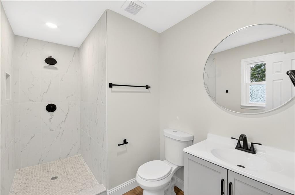 2776 Parcel Road Austell, GA 30106 - Photo 18 of 30 a bathroom with a sink toilet and shower