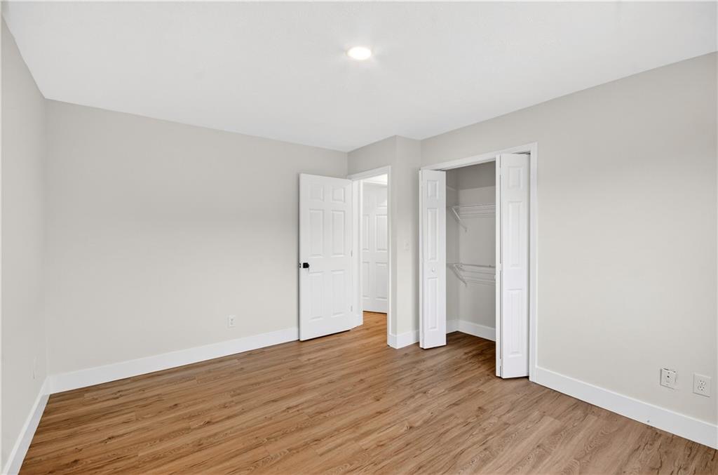 2776 Parcel Road Austell, GA 30106 - Photo 20 of 30 a view of an empty room with wooden floor and closet