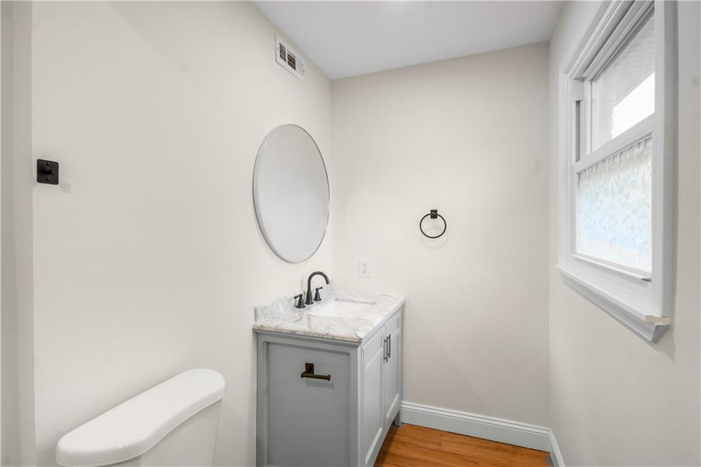 2776 Parcel Road Austell, GA 30106 - Photo 21 of 30 a bathroom with a toilet sink and mirror