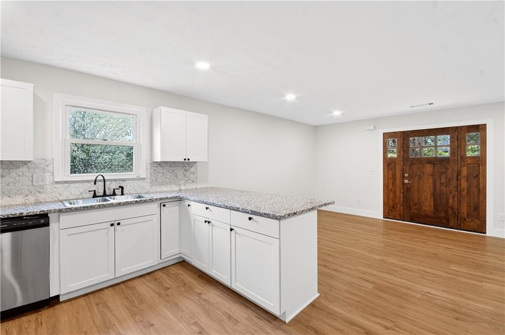 2776 Parcel Road Austell, GA 30106 - Photo 7 of 30 a kitchen with granite countertop a sink and cabinets