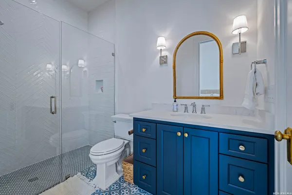 a view of an outdoor sitting area with furniture and umbrella