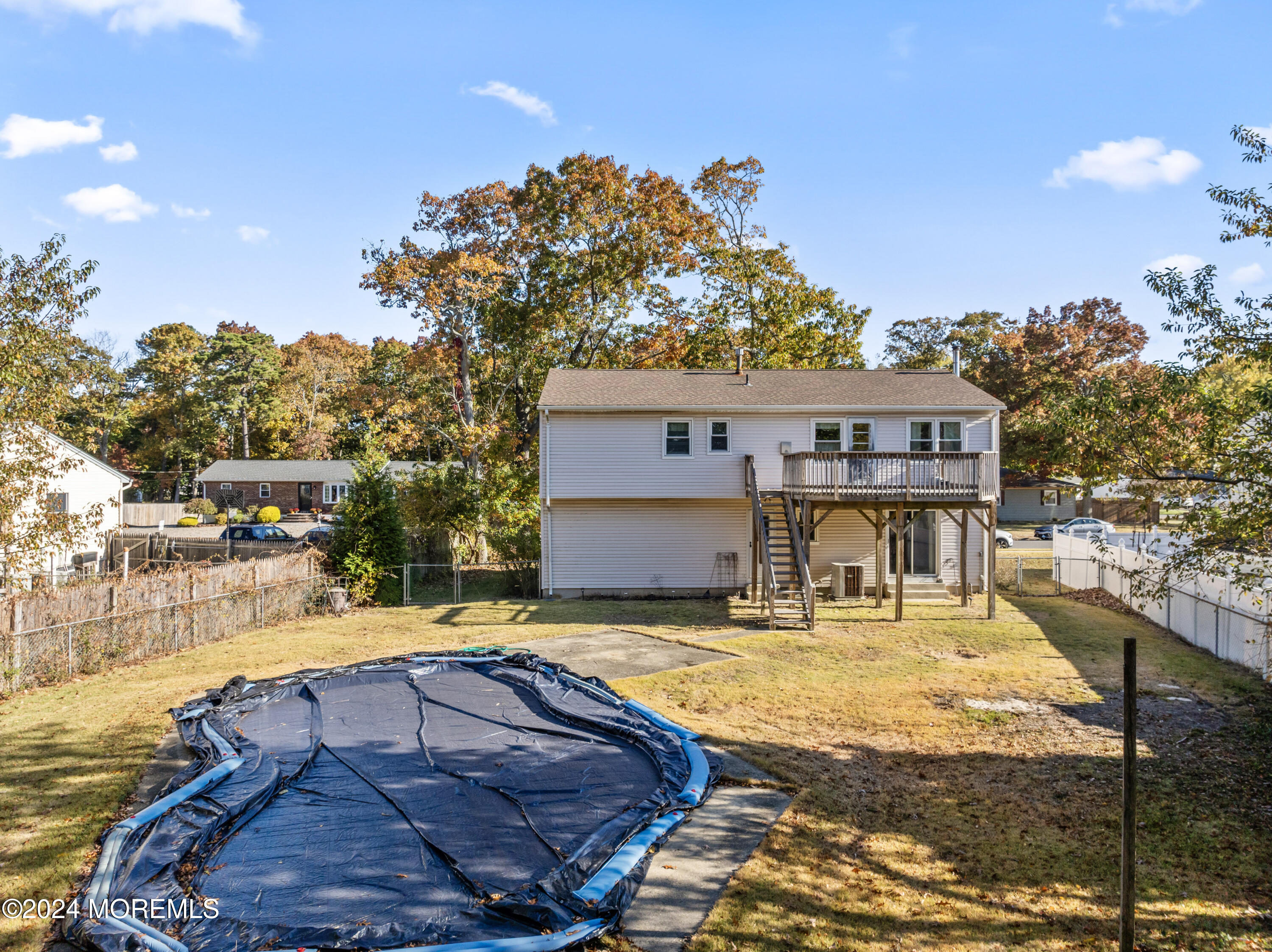 407 Reedy Drive Brick, NJ 08723 - Photo 29 of 35 a view of a swimming pool with a patio
