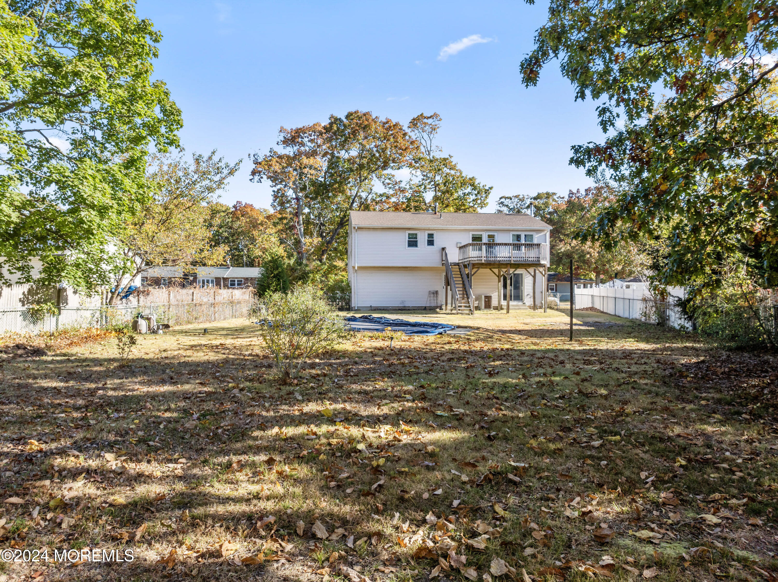 407 Reedy Drive Brick, NJ 08723 - Photo 30 of 35 a front view of a house with a garden