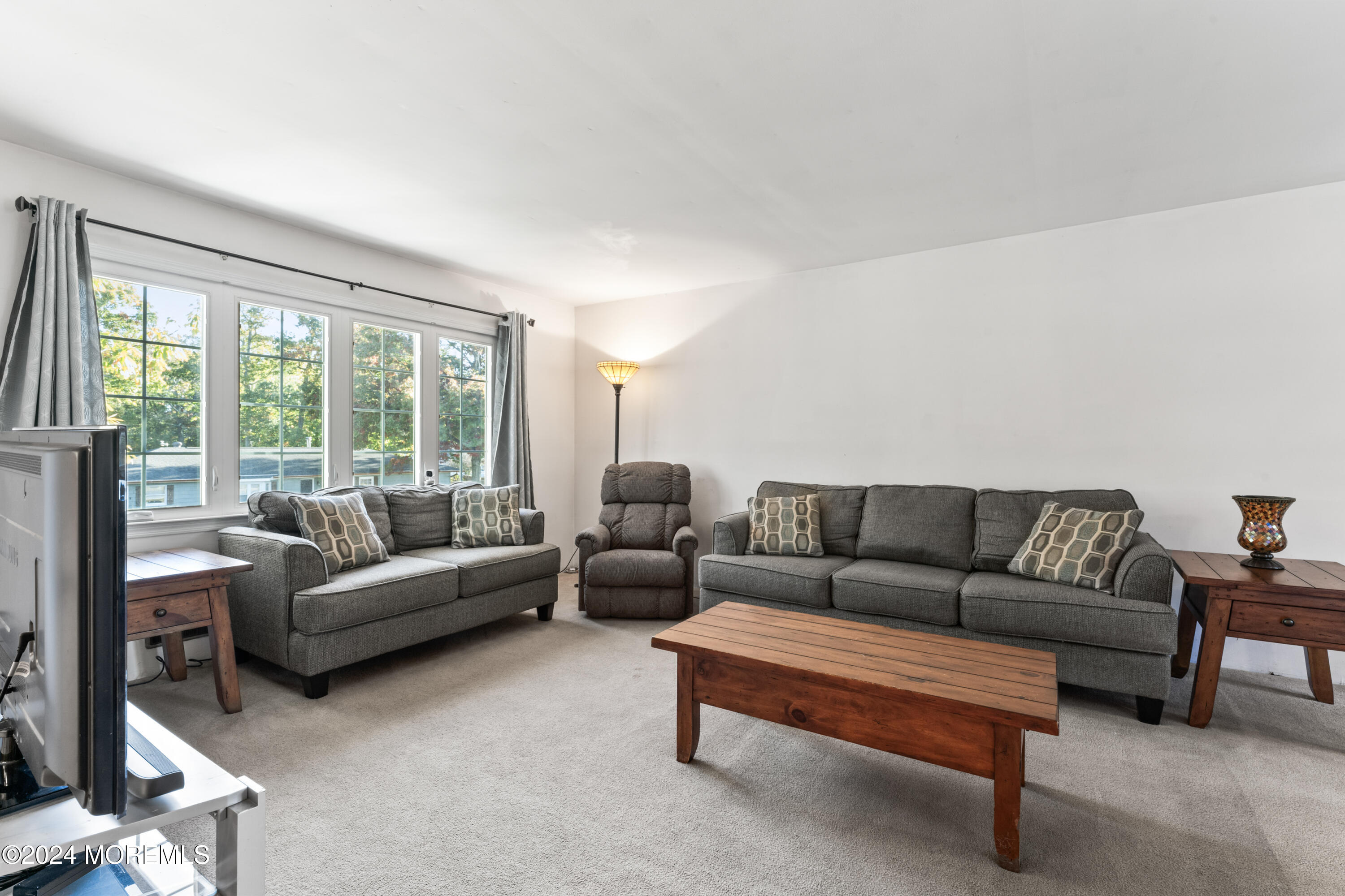 407 Reedy Drive Brick, NJ 08723 - Photo 5 of 35 a living room with furniture and a large window