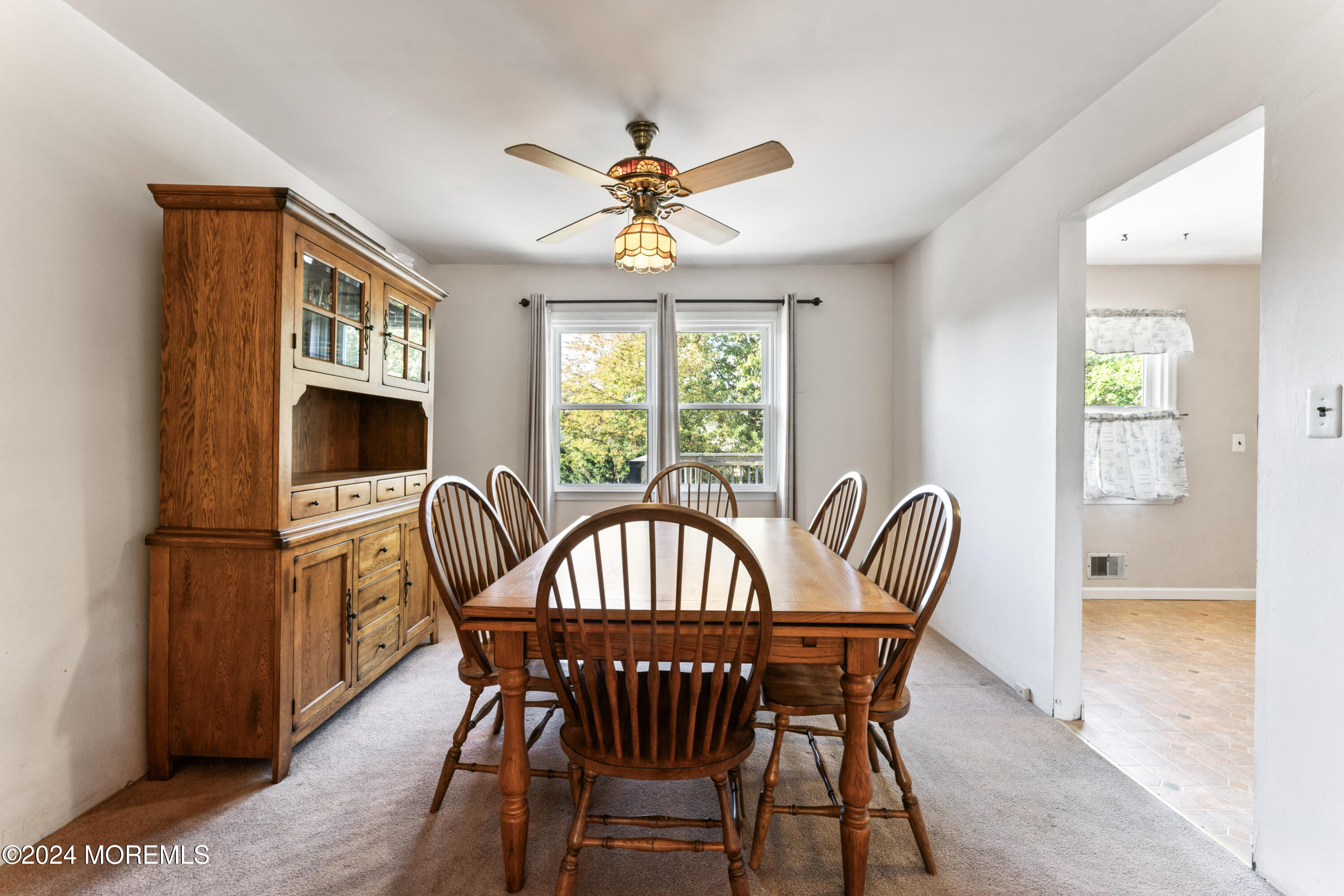 407 Reedy Drive Brick, NJ 08723 - Photo 7 of 35 a view of a dining room with furniture window and wooden floor