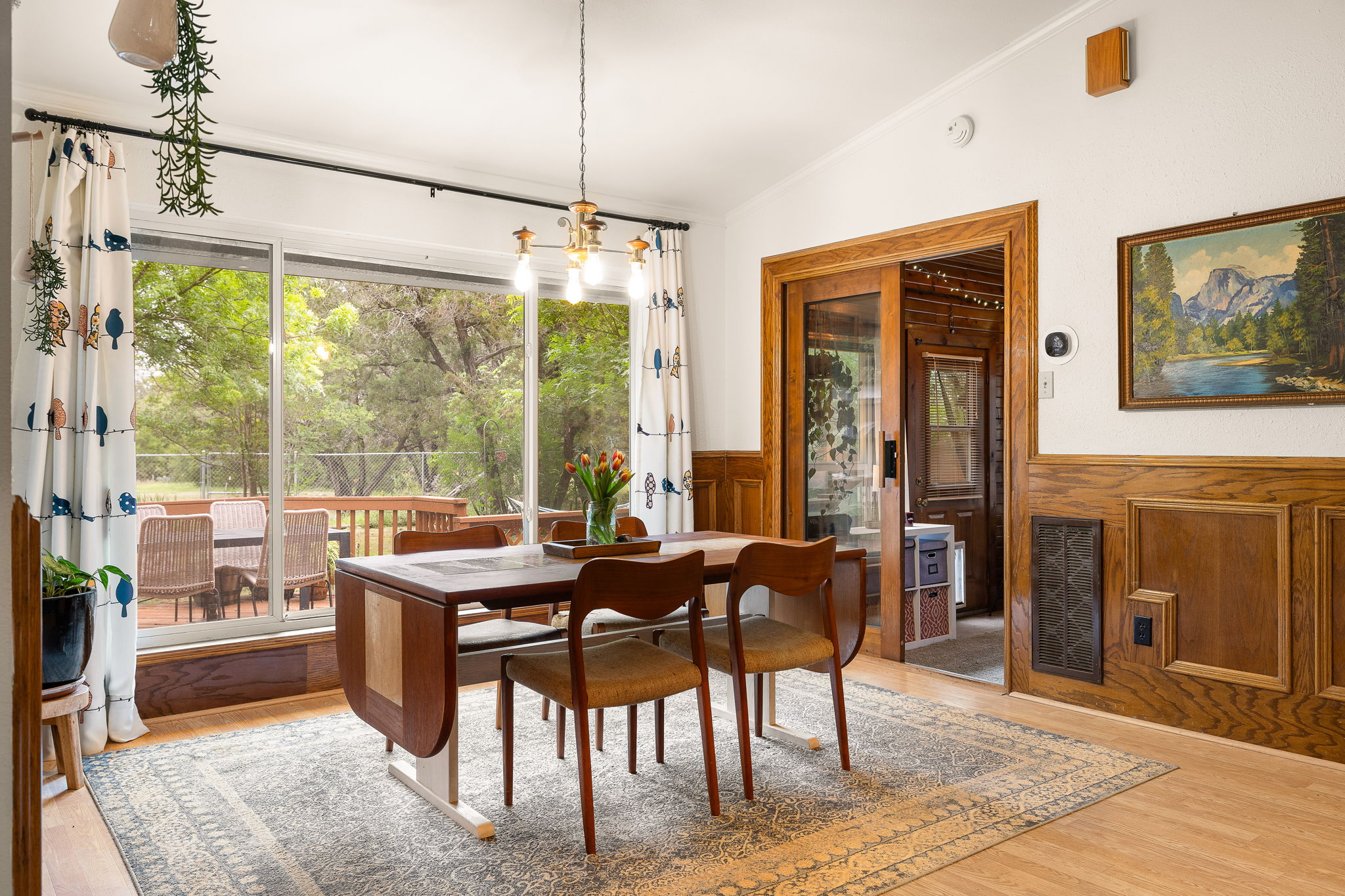 136 Valley View Road Georgetown, TX 78633 - Photo 13 of 40 This dining room is perfection! The massive windows overlooking the property, the woodwork and the open feel are just chef's kiss!! The entrance to the groovy log cabin sunroom is there on the right. This house is just so darn cool.