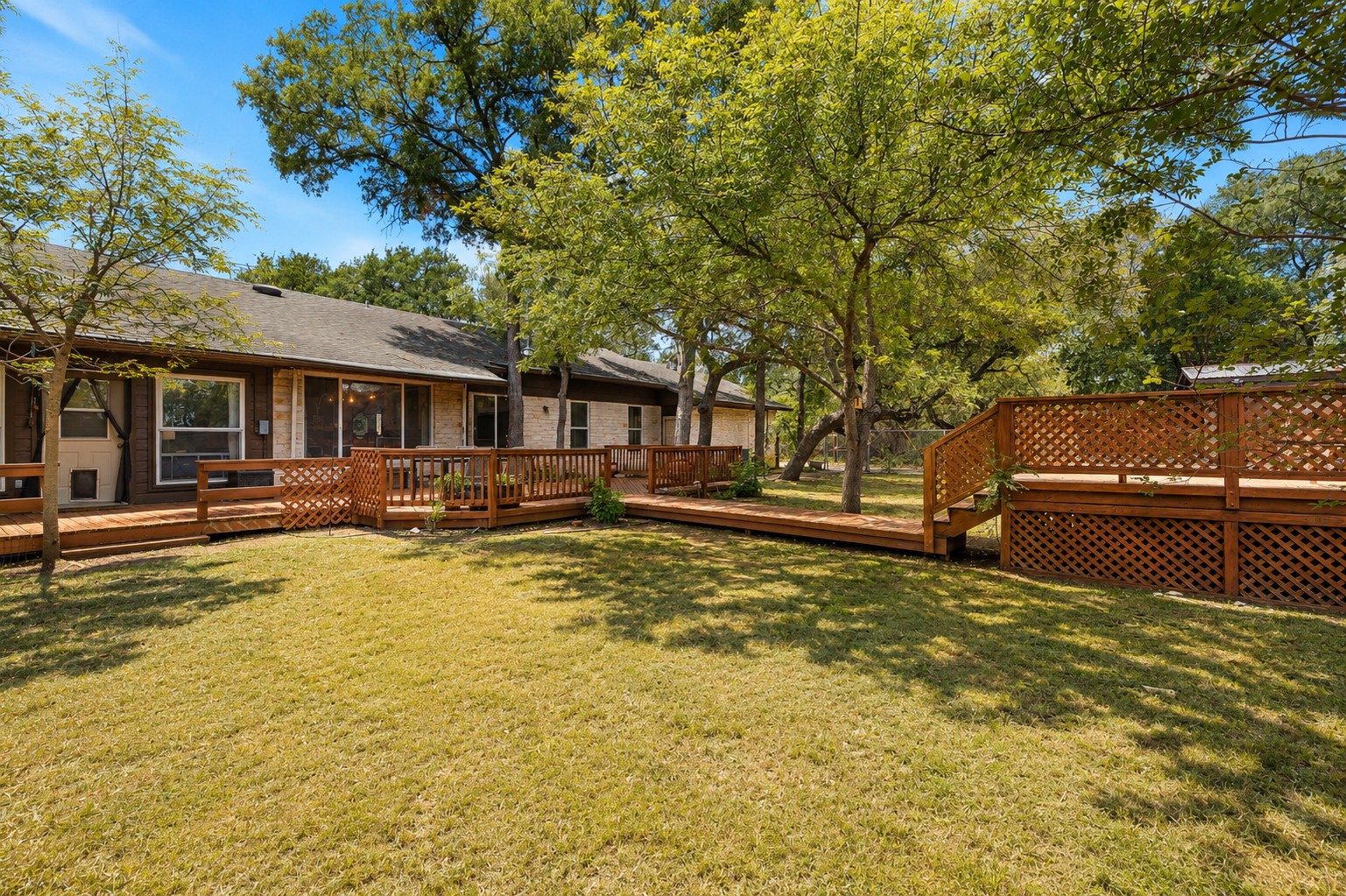 136 Valley View Road Georgetown, TX 78633 - Photo 28 of 40 View of the first section of the backyard that has a big deck, firepit, hammock hangout area and the awesome above-round pool that has its own deck.