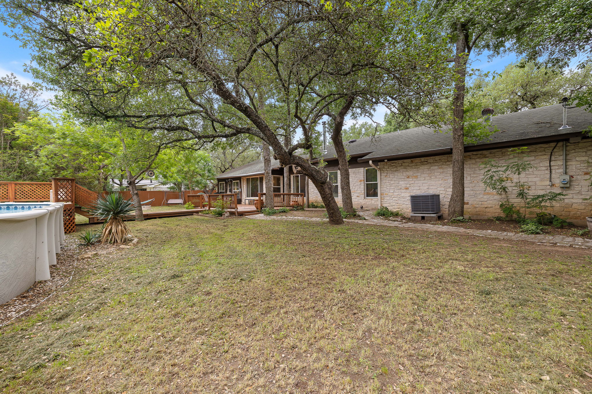 136 Valley View Road Georgetown, TX 78633 - Photo 32 of 40 Another view showing the back of the house and the oak trees.